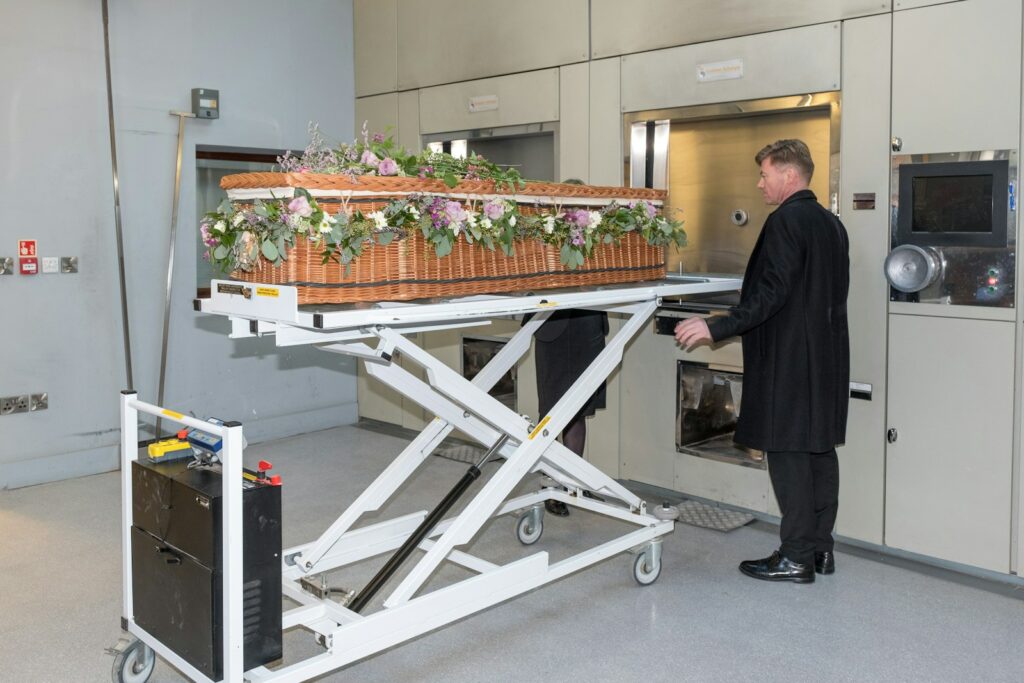 a man standing next to a table with a basket on it