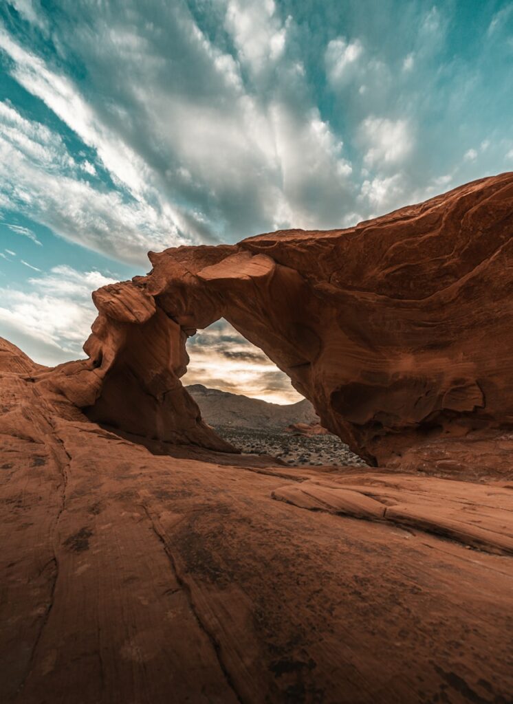 a large rock formation with a sky background