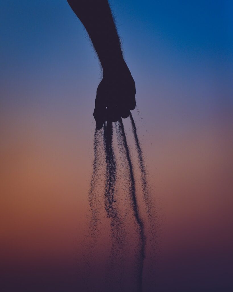 person dropping ashesfrom his hands