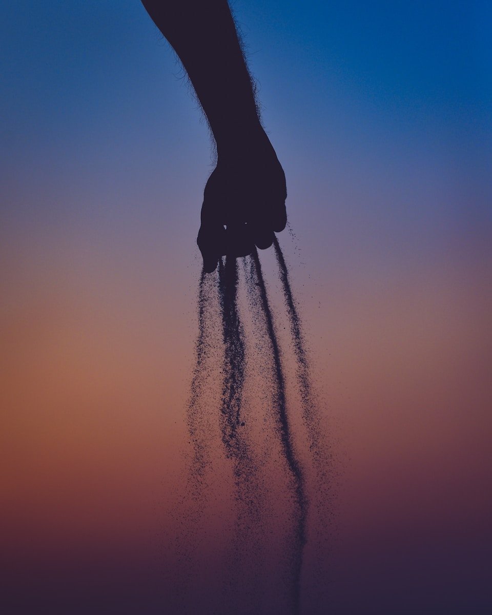 person dropping ashesfrom his hands