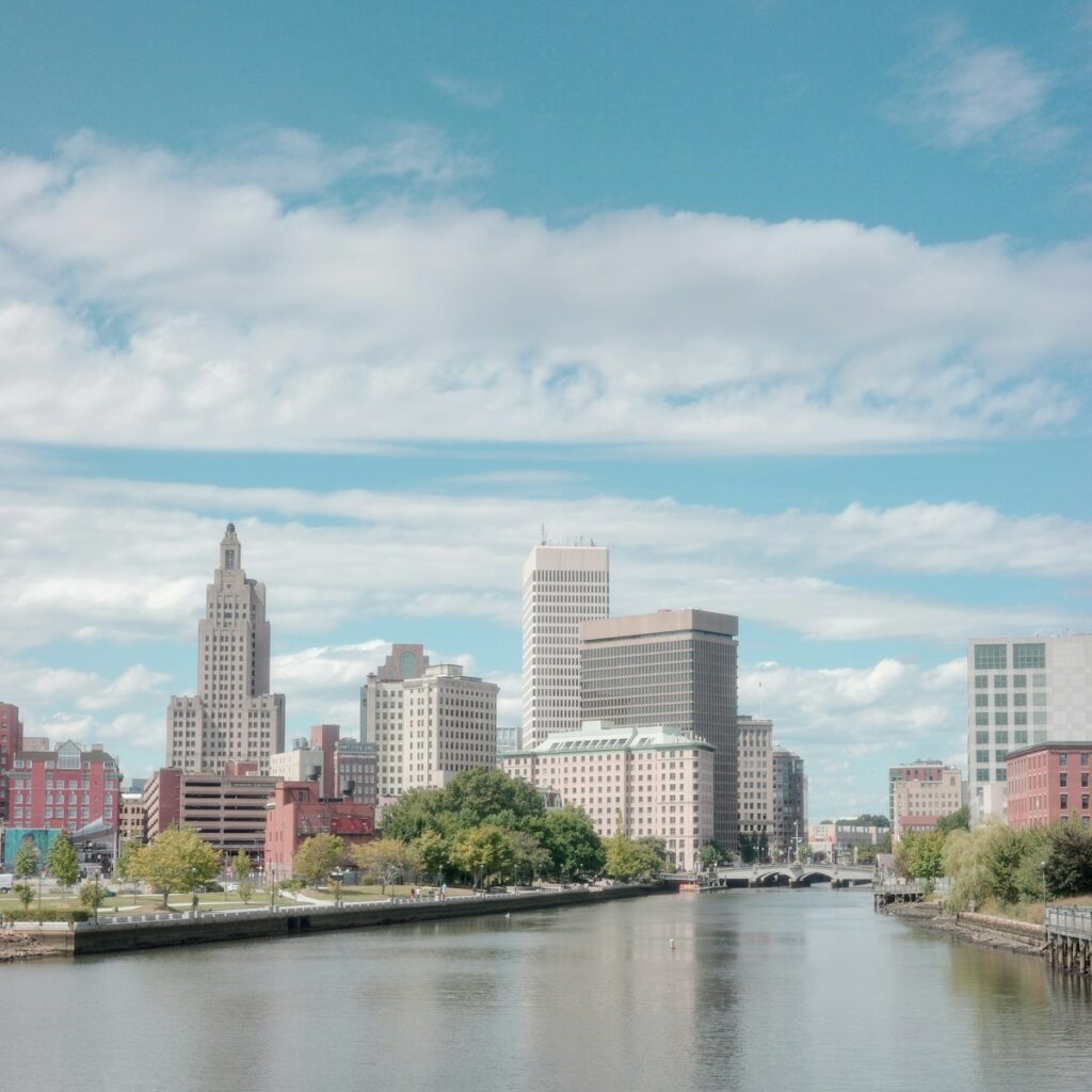 A river running through a city next to tall buildings